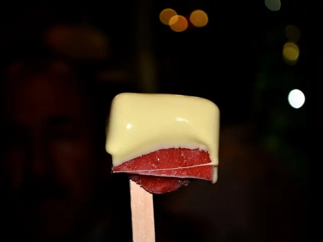 In this image, I can see an ice cream, lights and a dark color. This image is taken may be in a...