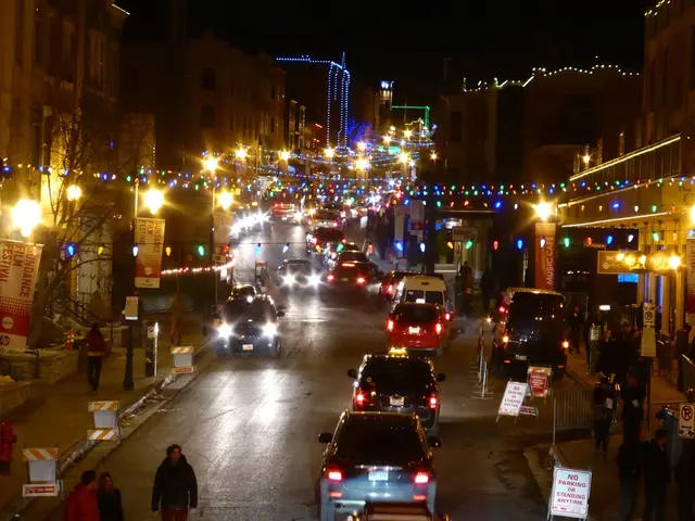 Here in this picture we can see number of cars, trucks and vans present on the road over there and...