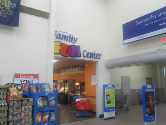 In this image there is a store in that store there are packets and in the background there is a...