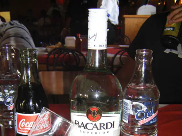 In this picture we can see alcohol bottle and some of the water bottles here, here is a one coco...